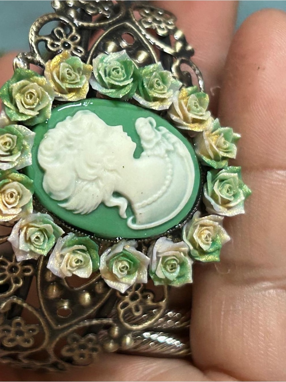 Vintage-Inspired Green Cameo Bracelet with Floral Accents